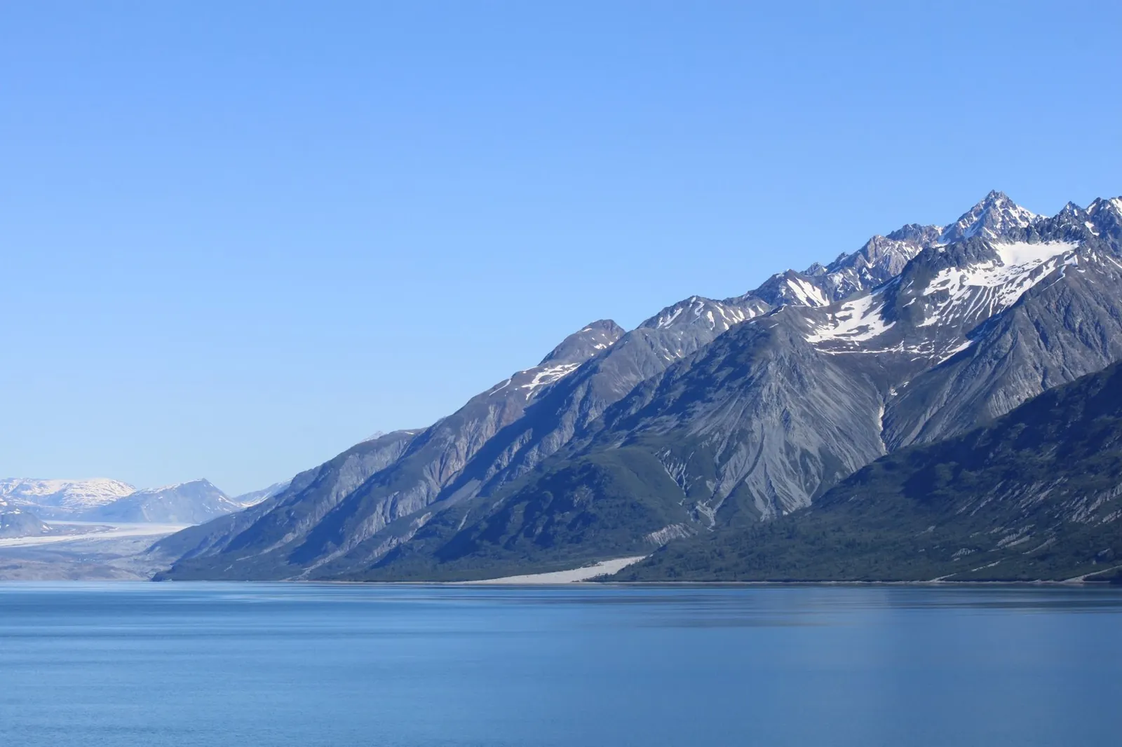 Alaskan mountain reflected in a glassy inlet