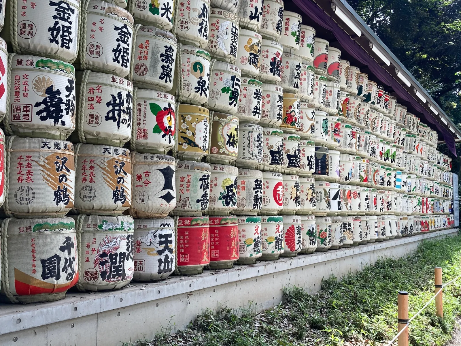 Wall of decorated sake barrels at Meiji Jingu shrine in Tokyo
