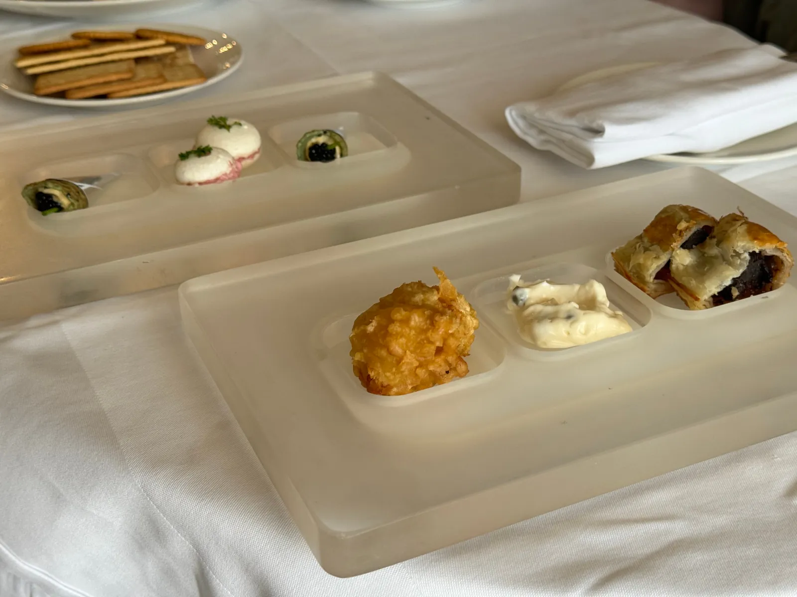 Assorted canapés, savory bites, and crackers in-suite